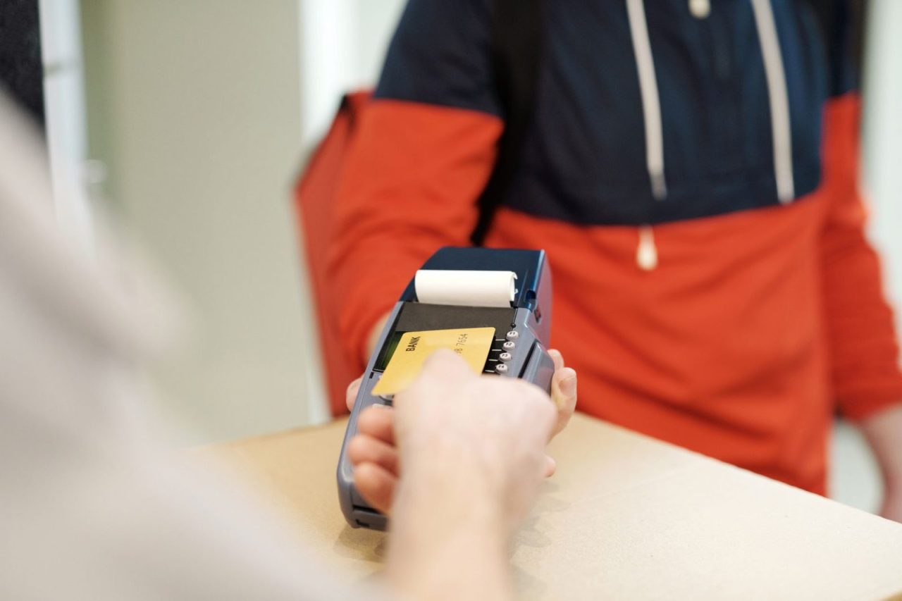 Contactless credit card payment in progress on a retail terminal