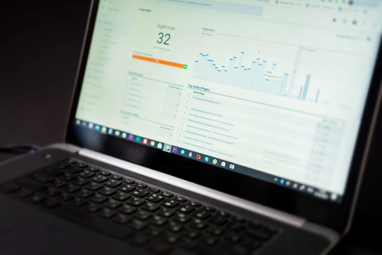 Laptop displaying an analytics dashboard with real-time data tracking tools